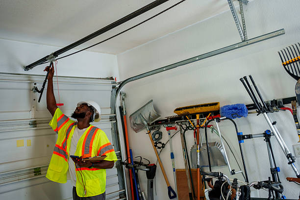 Professional Garage Door Installation technician working in Huntsville, AL